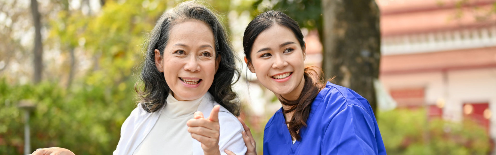 Smiling Caregiver and Elderly