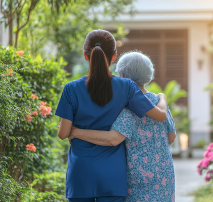 medical worker and senior woman back view