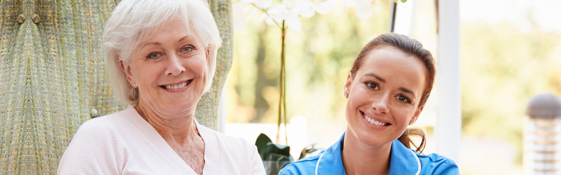 caregiver and senior smiling