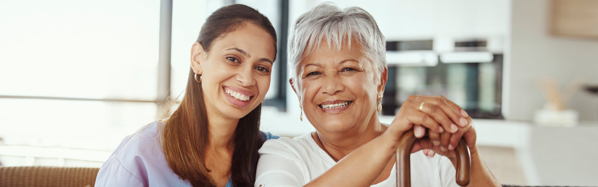 caregiver and senior smiling