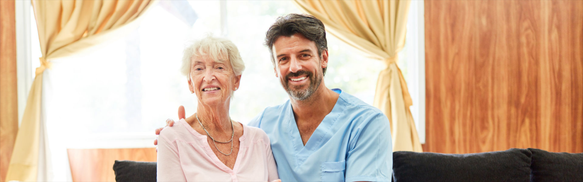 senior and caregiver smiling